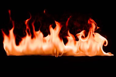 close up view of burning fire on black background clipart