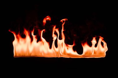close up view of burning orange fire on black background clipart