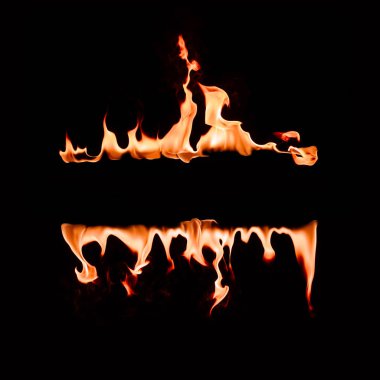close up view of burning flame lines on black background