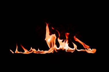 close up view of burning flame on black backdrop