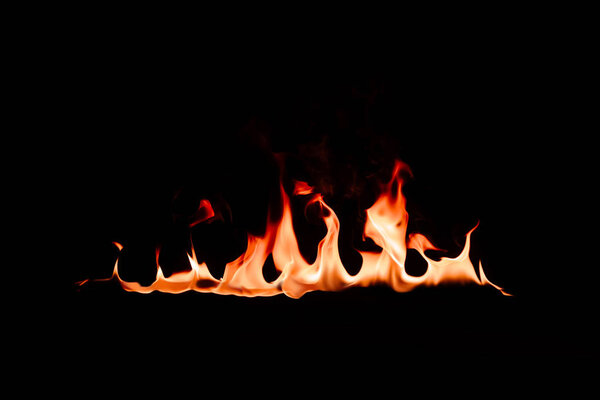 close up view of burning flame on black backdrop