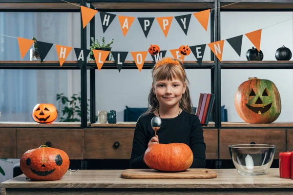 Portrait Smiling Kid Tabletop Pumpkins Hanging Happy Halloween Flags Home — Stock Photo, Image