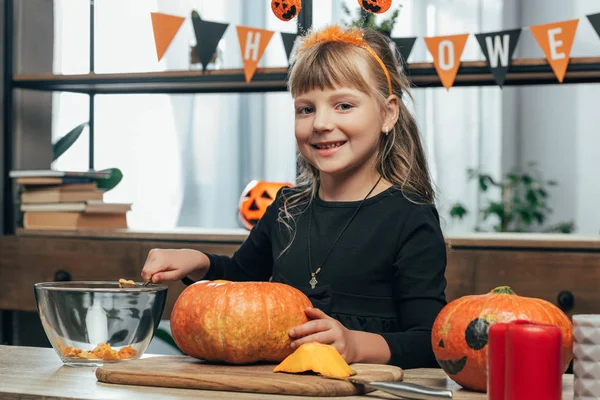 Portrait Smiling Kid Looking Camera While Carving Pumpkin Halloween Alone — Free Stock Photo