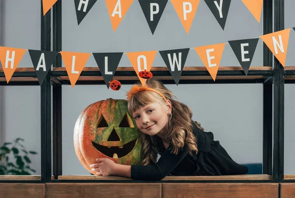 Portrait Smiling Child Halloween Costume Carved Pumpkin Hanging Flags Home — Stock Photo, Image
