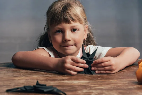 Portrait Little Child Black Paper Bats Looking Camera Home — Free Stock Photo