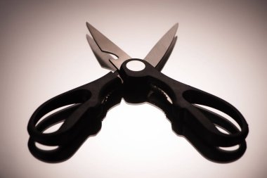 close-up view of professional kitchen scissors reflected on grey clipart