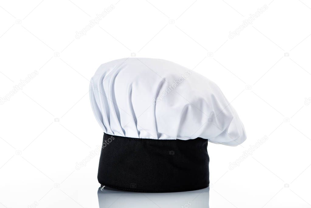 close-up view of single black and white chef hat on white