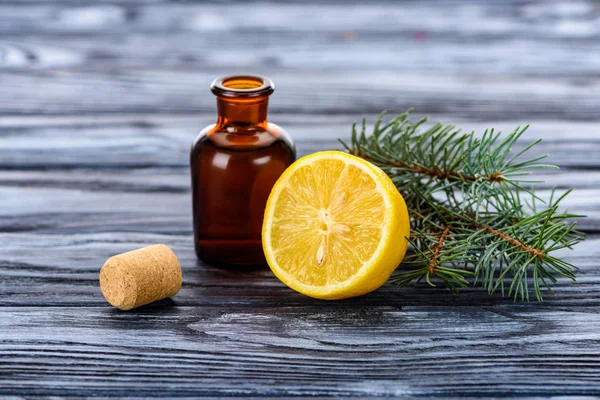Bottle Natural Herbal Essential Oil Fir Twigs Lemon Cork Surface — Stock Photo, Image