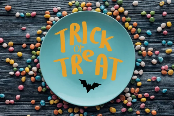 Top View Plate Bat Trick Treat Lettering Surrounded Colorful Candies — Stock Photo, Image