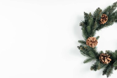 close-up view of beautiful christmas wreath with pine cones on white background clipart