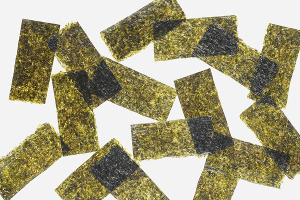 top view of green dried nori sheets isolated on white background  