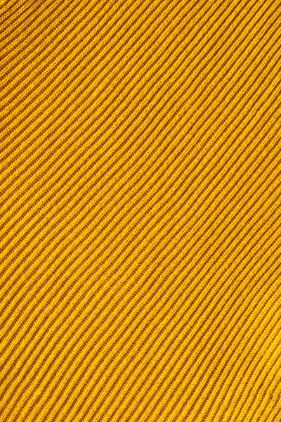 full frame of yellow woolen fabric backdrop