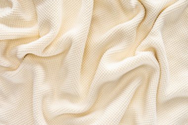 full frame of folded white woolen fabric background clipart