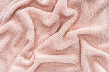 full frame of pink folded woolen fabric background clipart