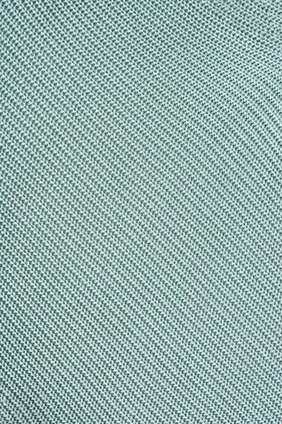 close up view of grey woolen fabric as background