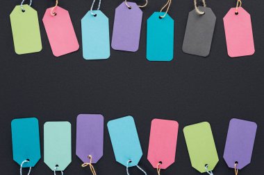 top view of colorful discount tags on black background for black friday    clipart