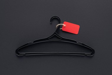 top view of hanger with empty red sale tag for black friday clipart