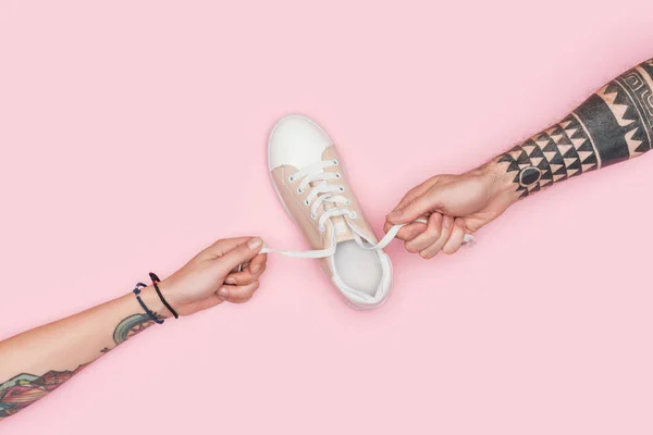 Partial View Tattooed People Holding Laces Sneaker Isolated Pink — Stock Photo, Image