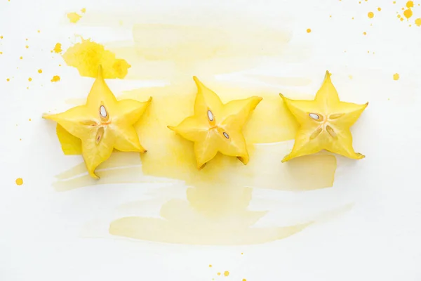 Top View Star Fruits Row White Surface Yellow Watercolor — Free Stock Photo