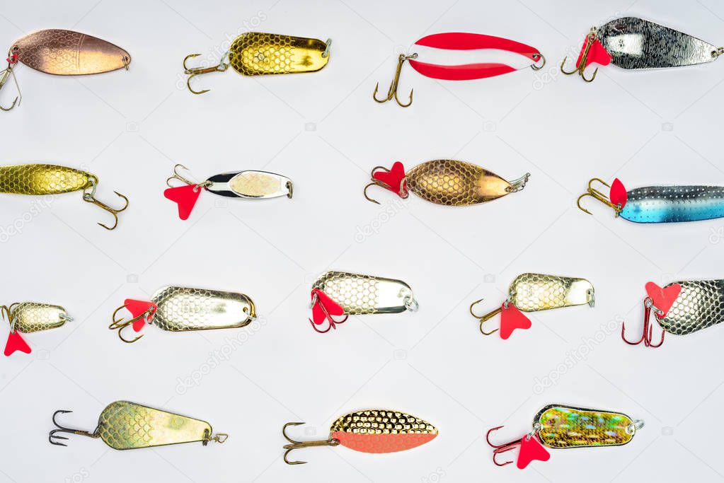 top view of arranged various fishing bait isolated on white 