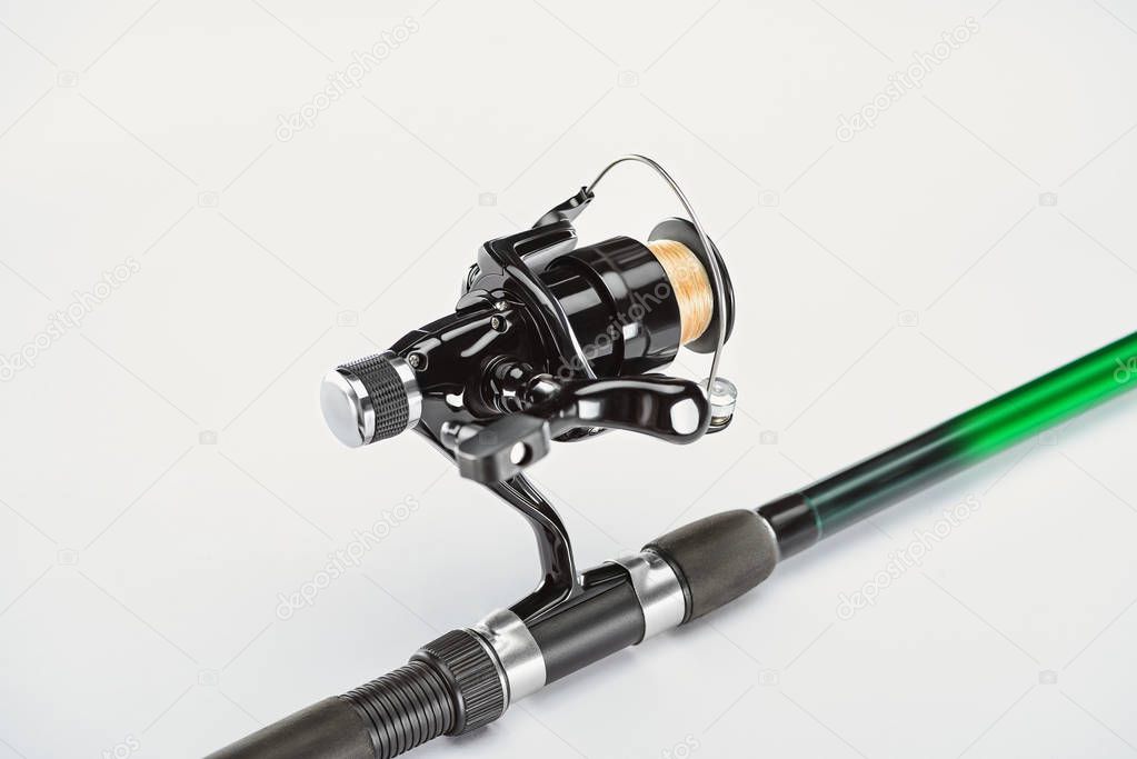 close up view of fishing rod isolated on white, minimalistic concept 