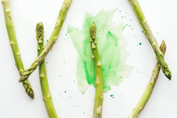 Top View Asparagus Stems White Surface Green Watercolor Strokes — Stock Photo, Image