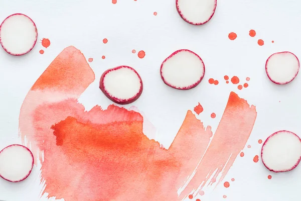 Top View Sliced Radish White Surface Red Watercolor Strokes — Stock Photo, Image