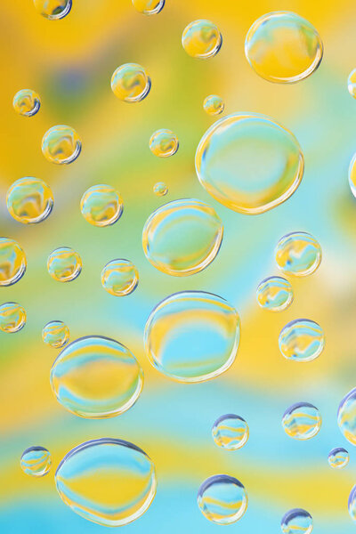 beautiful clean water drops on bright blurred abstract background  