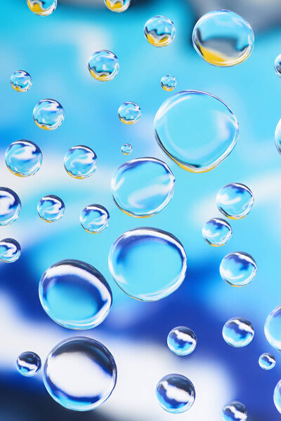 close-up view of beautiful transparent water drops on blue abstract background