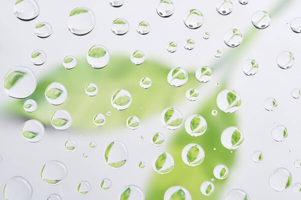 beautiful clean water drops on blurred abstract background