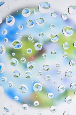 close-up view of beautiful clear water drops on blurred abstract background clipart