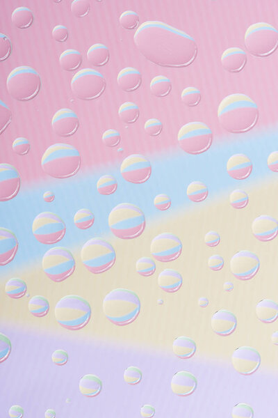 close-up view of transparent water drops on abstract background