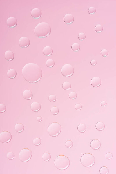 abstract background with transparent water drops on pink