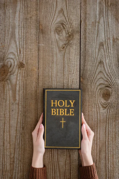 Cropped Shot Woman Holding Holy Bible Wooden Tabletop — Stock Photo, Image