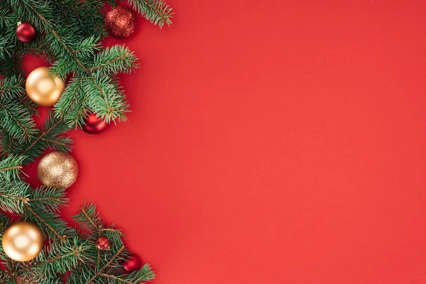 Flat lay with pine tree branches with red and golden christmas balls isolated on red — Stock Image Flat Lay Pine Tree Branches Red Golden Christmas Balls Isolated Royalty Free Stock Images