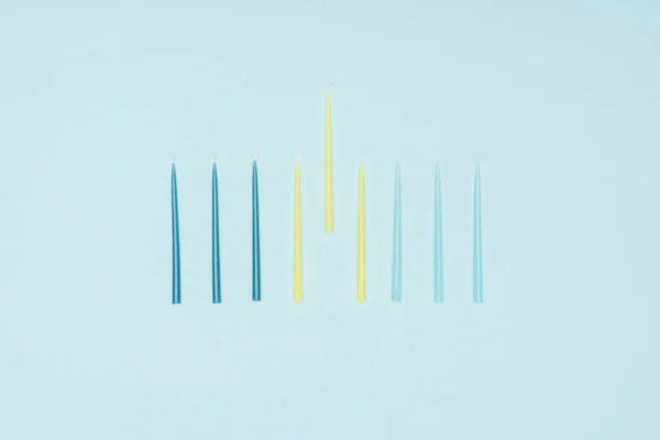 Flat Lay Blue Yellow Candles Hannukah Holiday Isolated Blue Hannukah — Stock Photo, Image