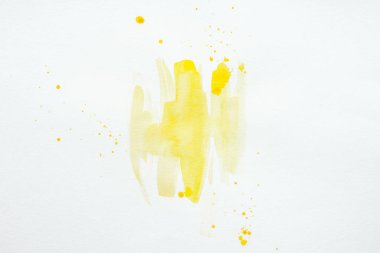 Beyaz Kağıt arka plan üzerinde soyut sarı suluboya splatters