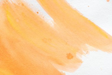 beyaz kağıt üzerinde soyut turuncu suluboya resim kapat