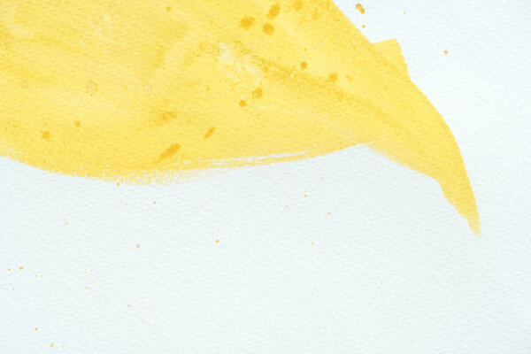 abstract background with yellow watercolor stroke with splatters