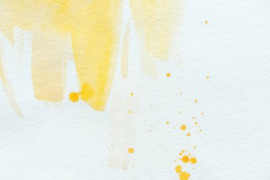 sarı sulu boya konturları ve Beyaz Kağıt arka plan üzerinde splatters