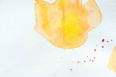 abstract orange and yellow watercolor painting on white paper clipart