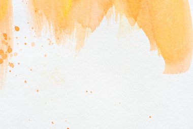 beyaz kağıt üzerinde soyut turuncu suluboya resim