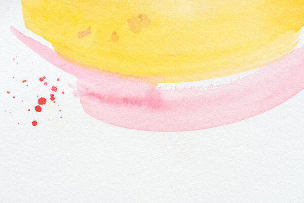 abstract background with yellow and pink watercolor strokes 