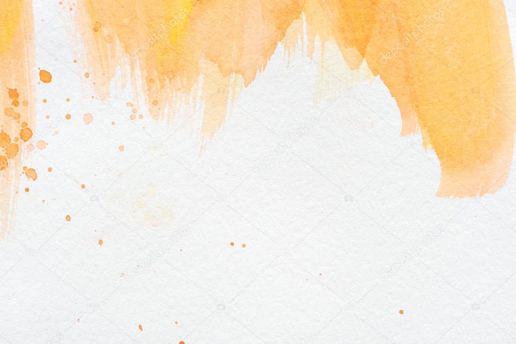 abstract orange watercolor painting on white paper