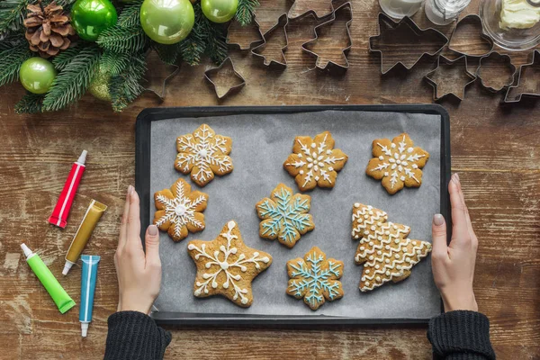 Partial View Woman Holding Baking Pan Homemade Christmas Cookies Wooden — Stock Photo, Image