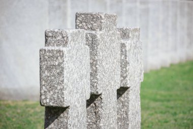 close up view of old memorial headstones placed in row at cemetery  clipart