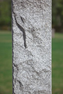 close up shot of stone memorial monument at cemetery  clipart