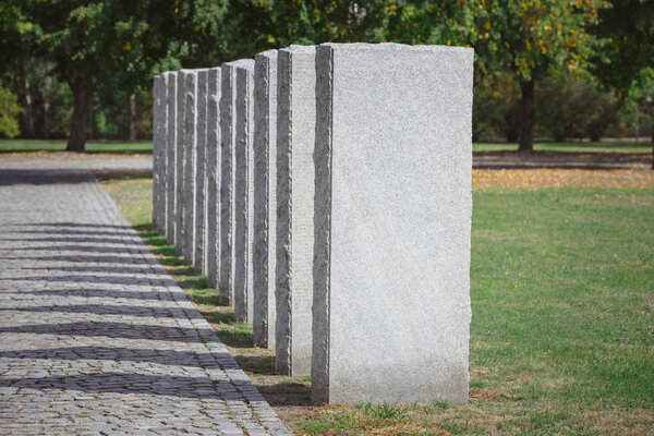 selective focus of stone tombs placed in row at graveyard