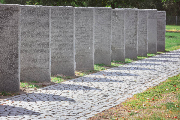 memorial gravestones with lettering placed in row at cemetery