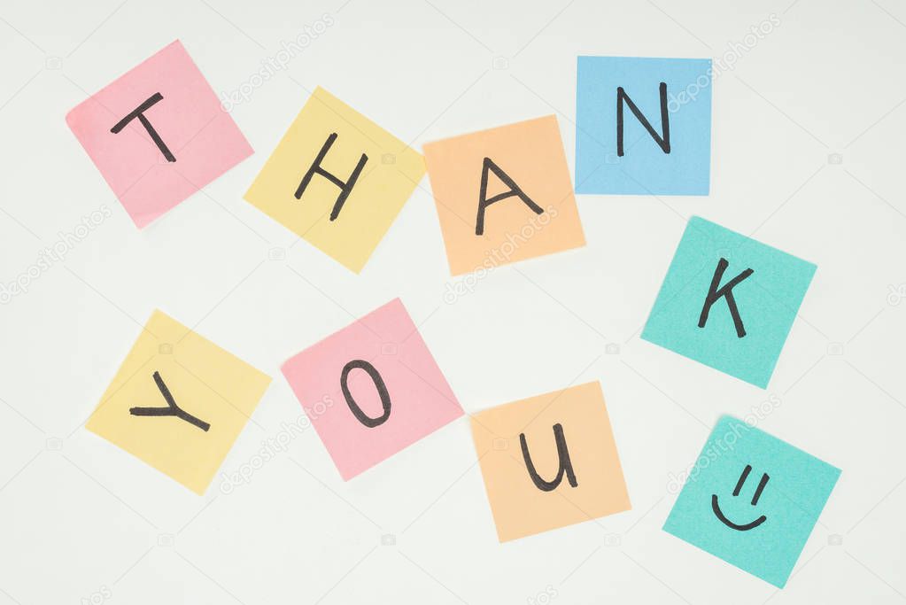 colorful sticky notes spelling thank you isolated on white background